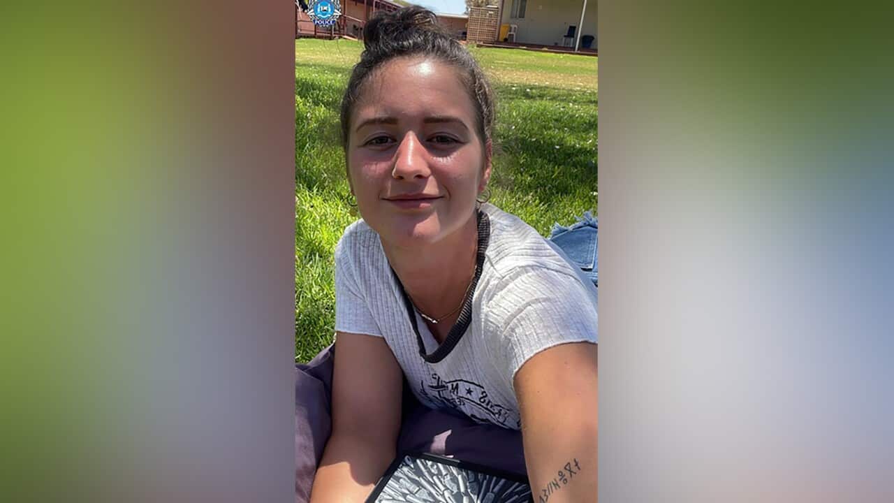 A woman smiling in a photo.