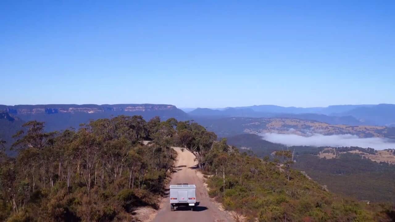 Cub Camper trailer being pulled by a 4 wheel drive