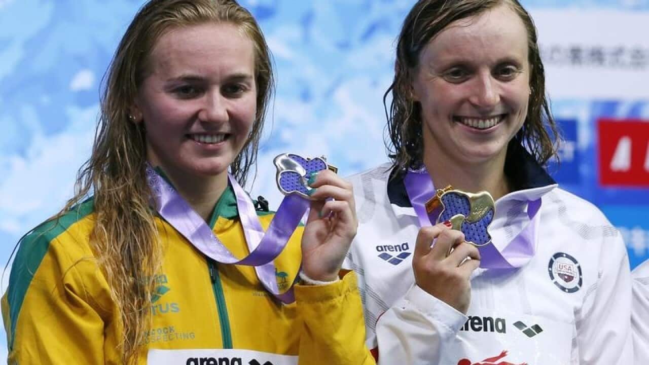 Australian swimmer Ariarne Titmus (L) and American Katie Ledecky