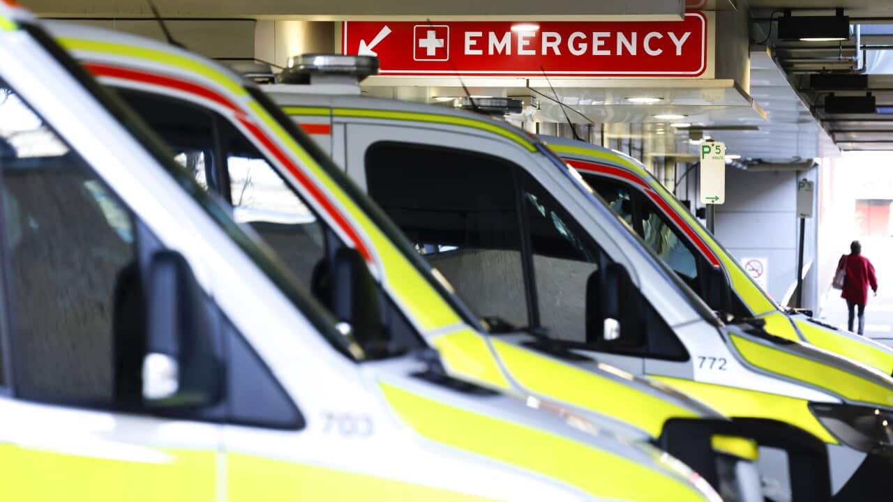 Ambulances lined up outside a hospital.