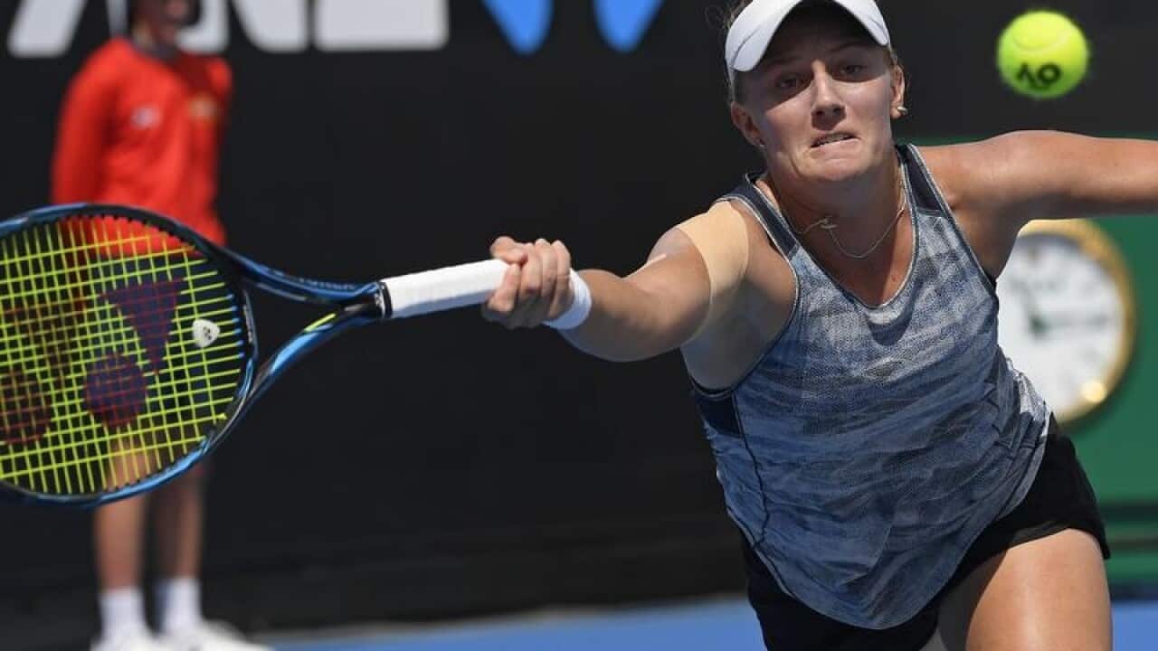 Australia's Zoe Hives makes a forehand return.