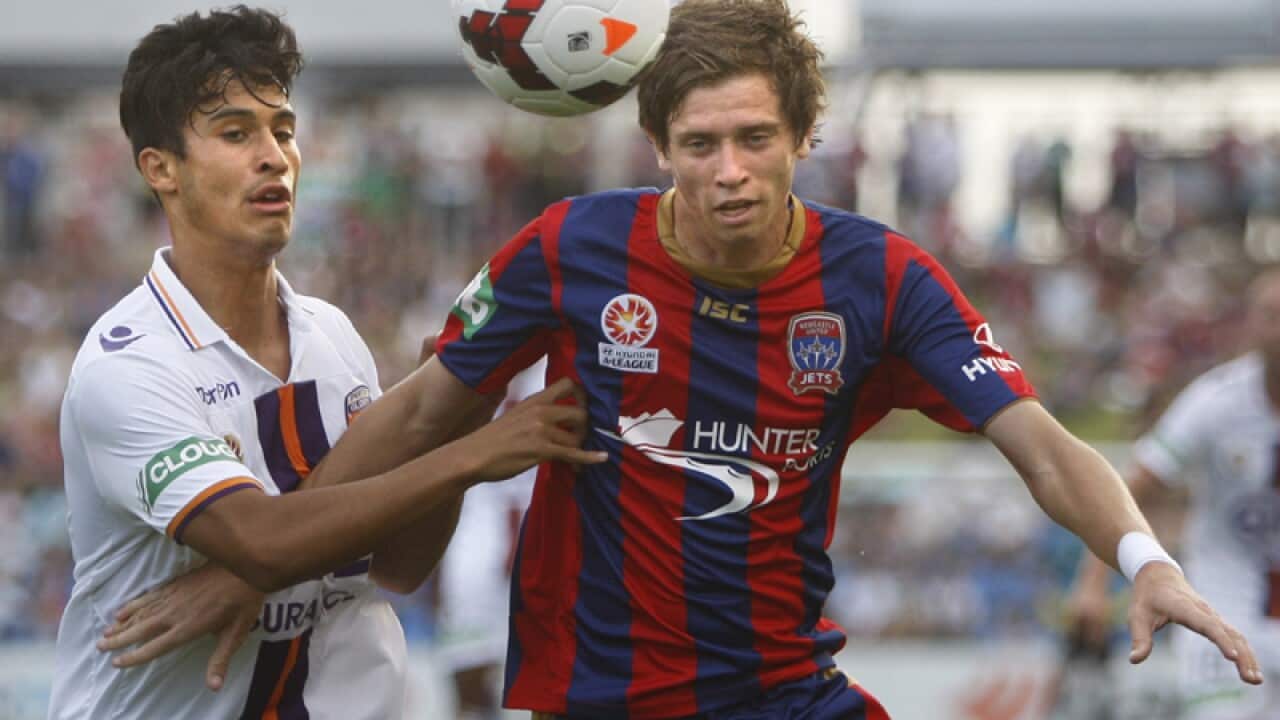 Glory's Matthew Davies (L) and Jets' Craig Goodwin