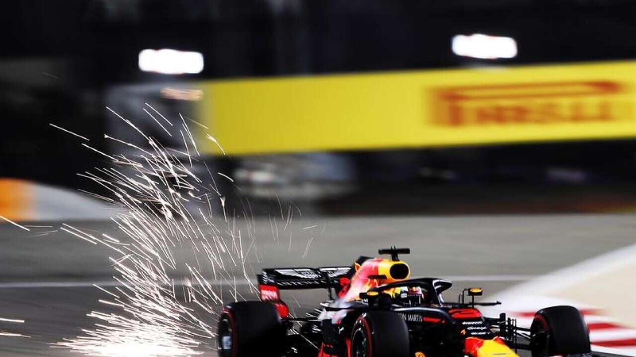 Sparks fly behind Daniel Ricciardo's car in the Bahrain Grand Prix.