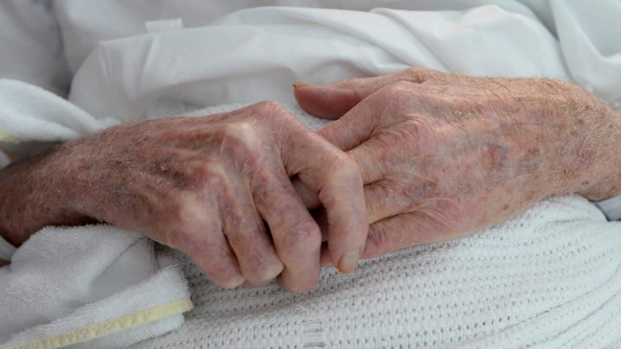 A woman in a hospital bed