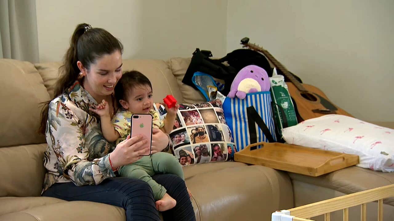 Chelsea Sonkar on the phone with husband, Sanjay