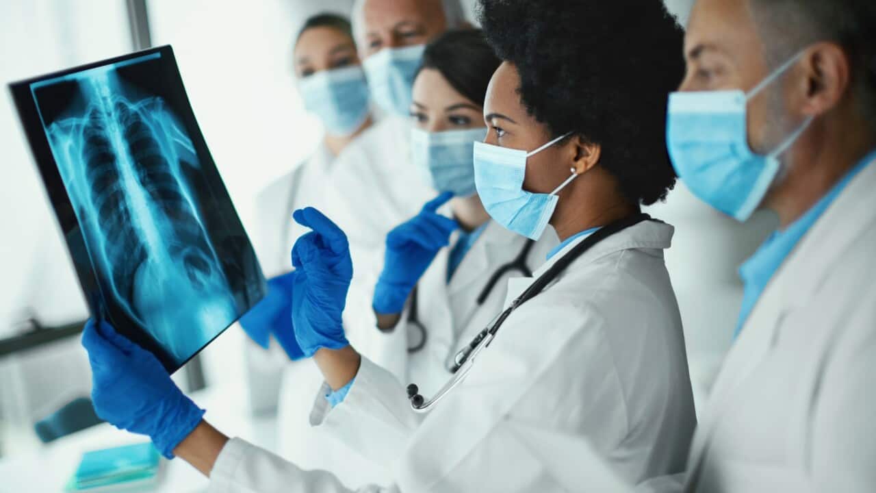 Team Of Doctors Analyzing An Xray Image Of A Covid19 Patient High-Res Stock Photo - Getty Images