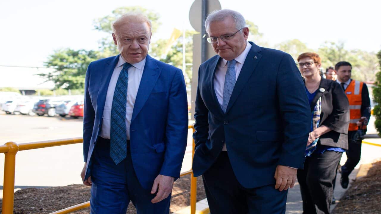 Prime Minister Scott Morrison (right) speaks with Executive Chairman of Visy Industries Anthony Pratt before touring their manufacturing facility in Penrith, Greater Sydney, Friday, February 26, 2021. (AAP Image/Paul Braven) NO ARCHIVING