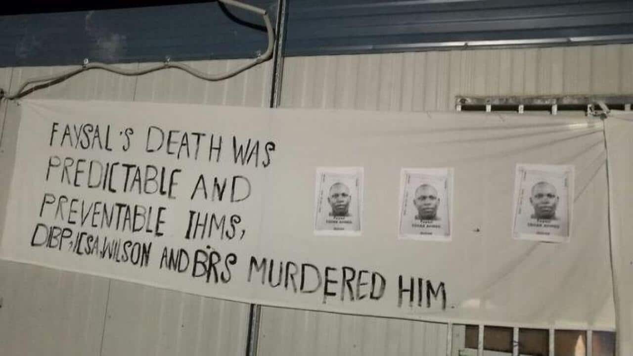 A banner put up during a vigil for Faysal Ishak Ahmed at the Manus Island detention centre (Supplied)