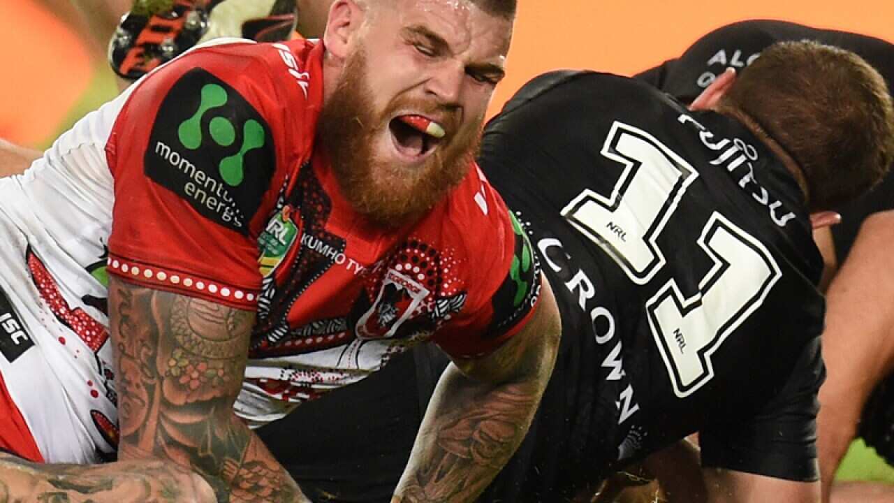 Josh Dugan of the Dragons grimaces in pain