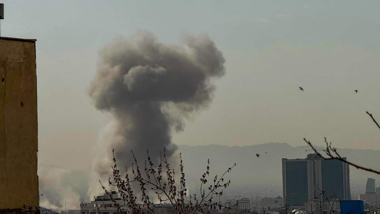 A plume of smoke rises after an attack.