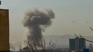 A plume of smoke rises after an attack.