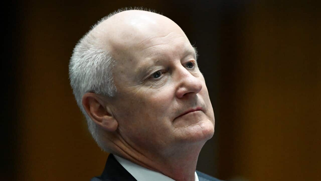 A balding man in a suit