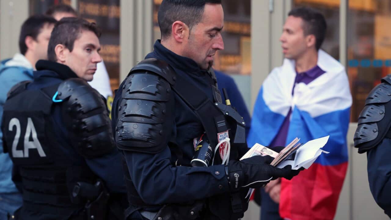 French police check the dociments of Russian fans in Lille