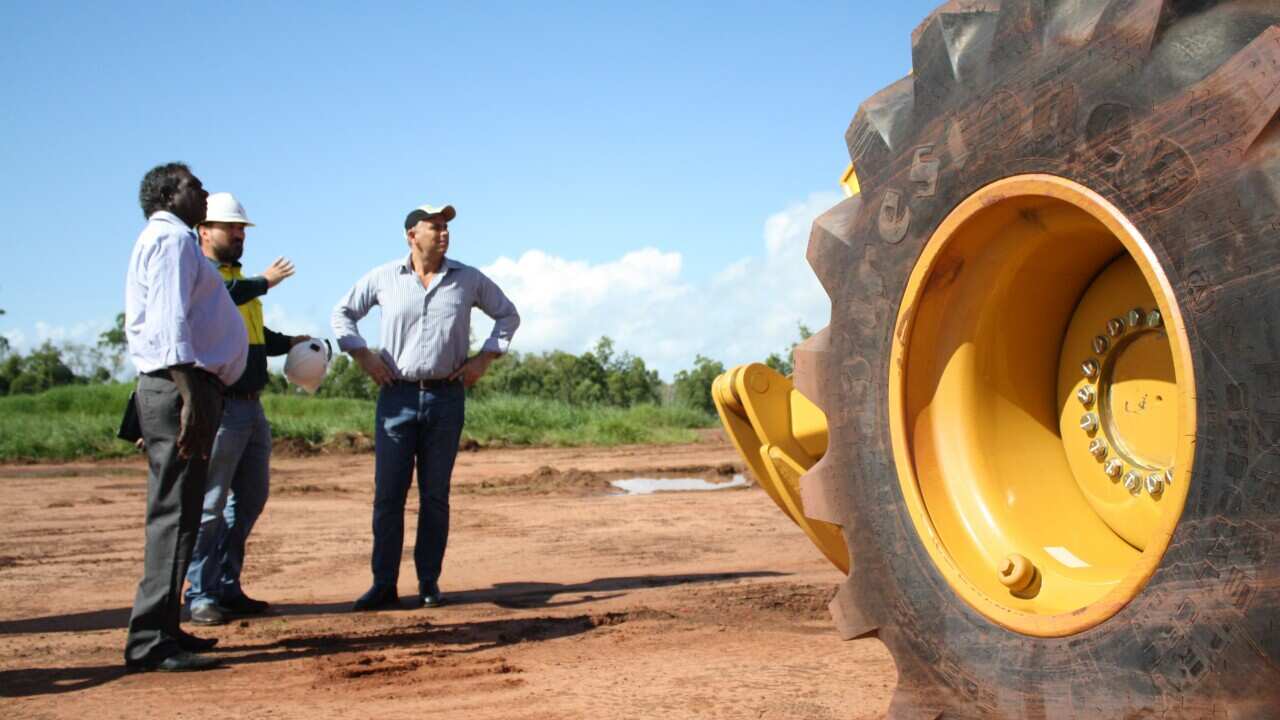 Northern Territory Chief Minister Adam Giles, right, and Member for Arafura Francis Xavier Kurrupuwu, left, inspect the $50 million Port Melville construction site on Melville Island 