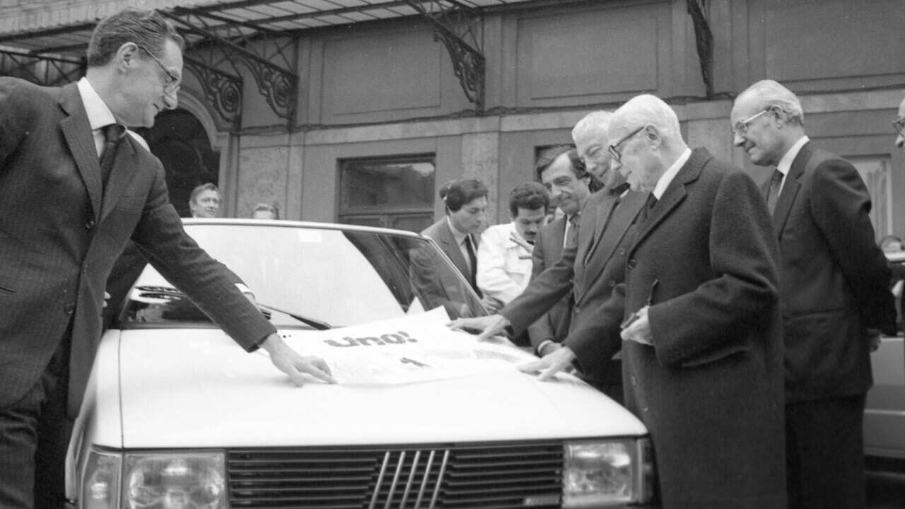 Avv Gianni Agnelli ahn Romiti present a new Fiat product UNO to Italian President Sandro Pertini