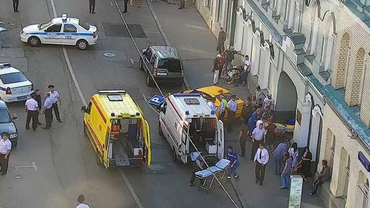 Emergency services treat the injured at the scene