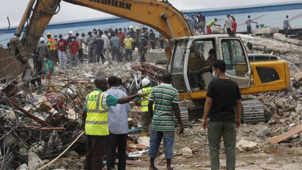 Rescue workers search for survivors after a church building collapse