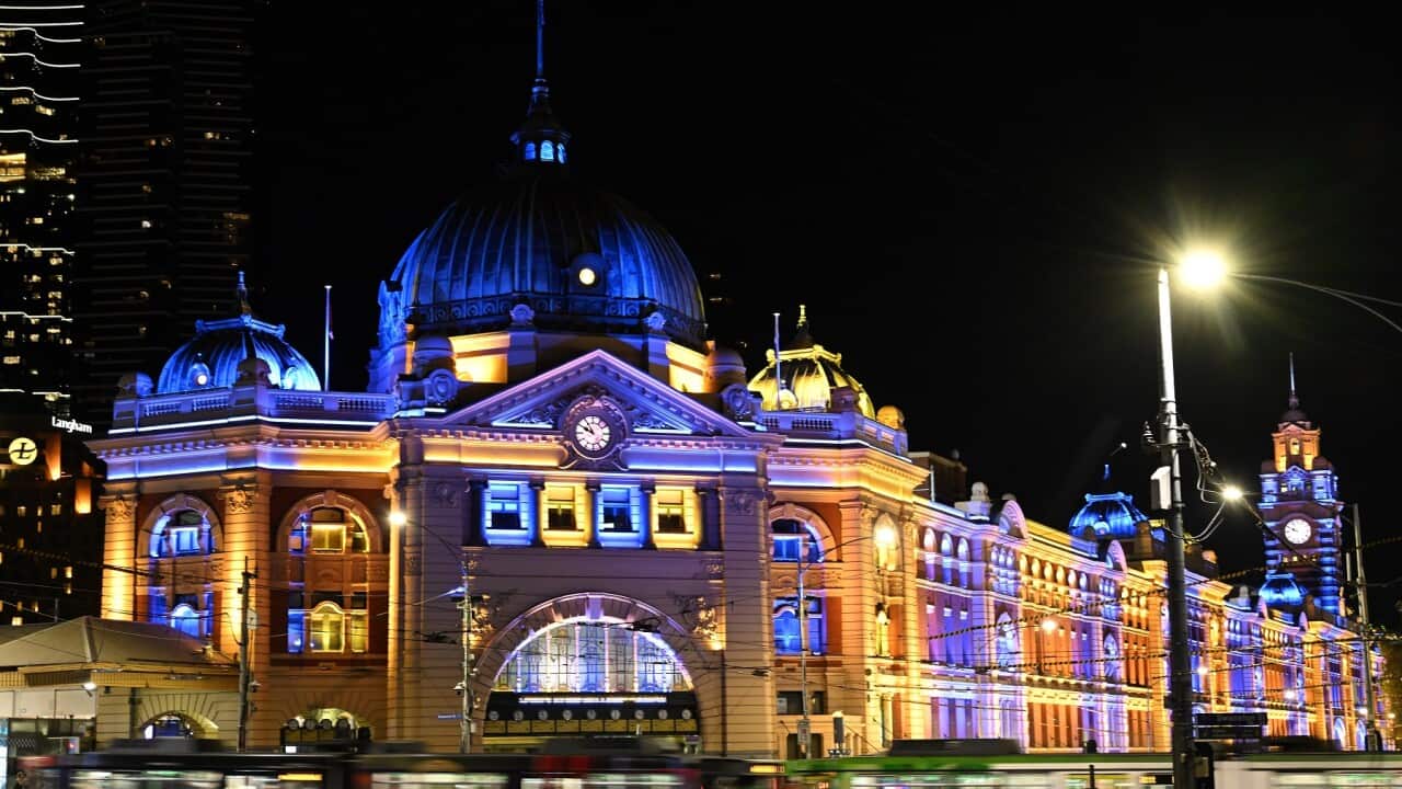 Flinders Street Station in Melbourne lit up in the colours of the Ukrainian flag to mark the first anniversary of Russia's invasion