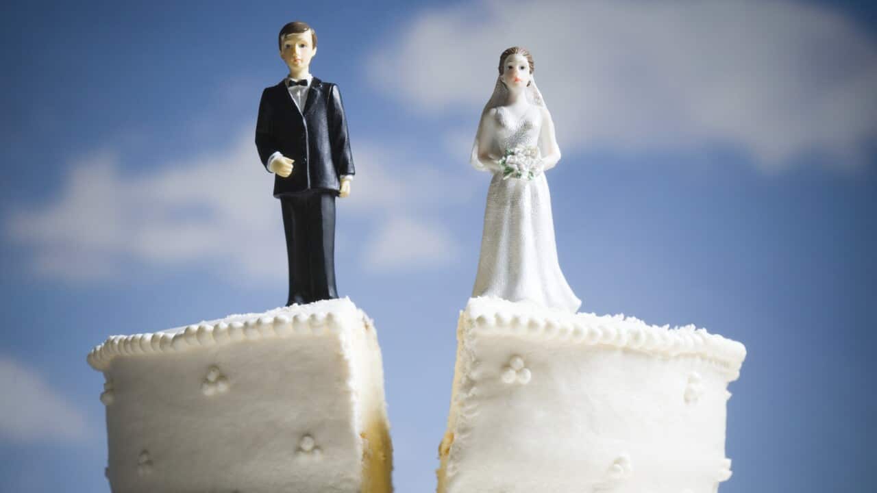 Wedding cake visual metaphor with figurine cake toppers