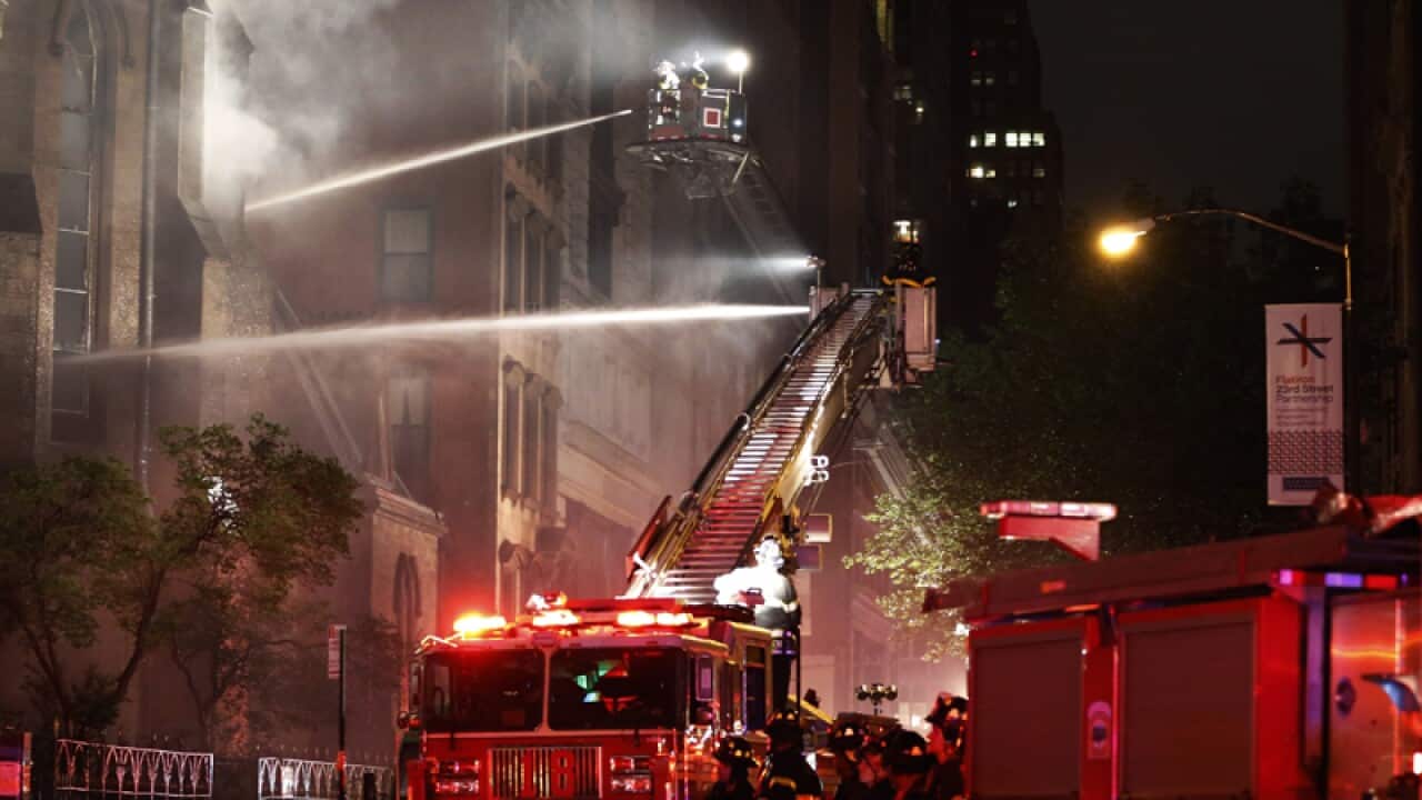 Firefighters battle a three-alarm fire