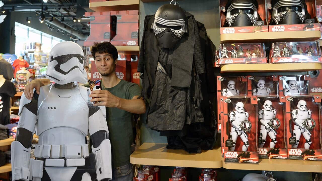 Star Wars fans in US cities queued into the wee hours of Friday morning for toys, gadgets and souvenirs that are part of an early marketing campaign for the film franchise's next instalment, Star Wars: the Force Awakens.