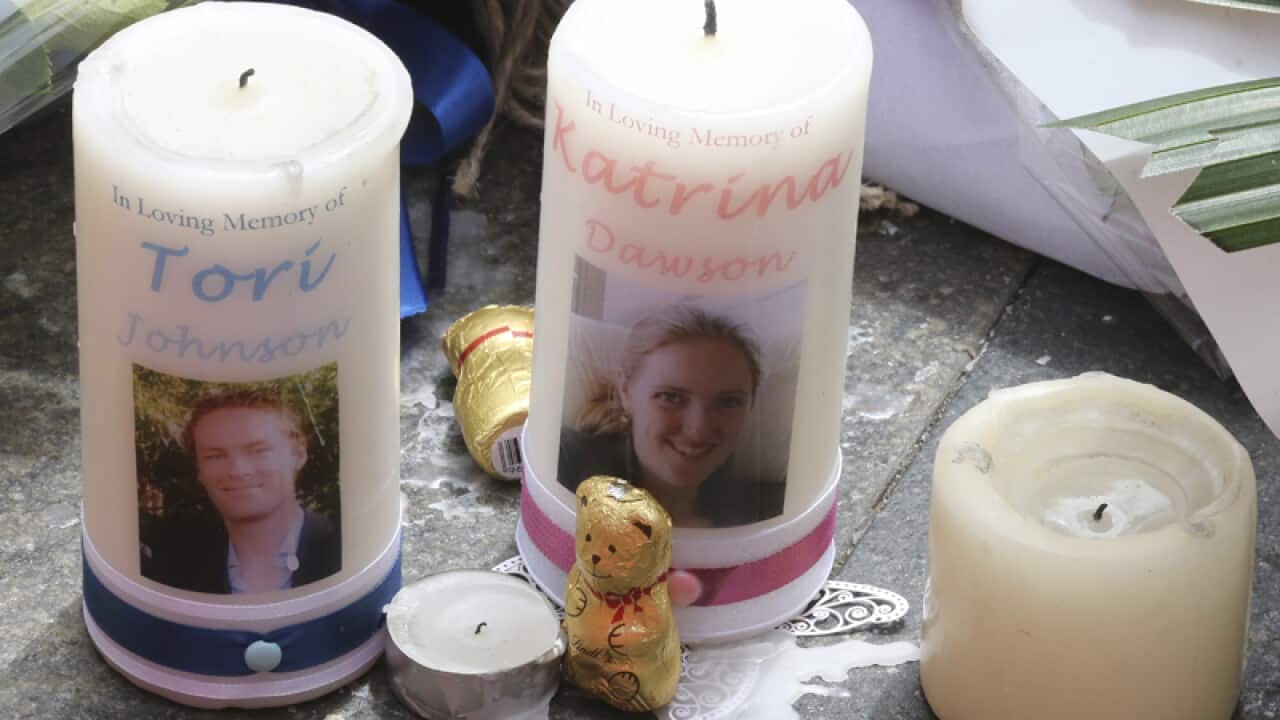 Candle tributes to Tori Johnson and Katrina Dawson