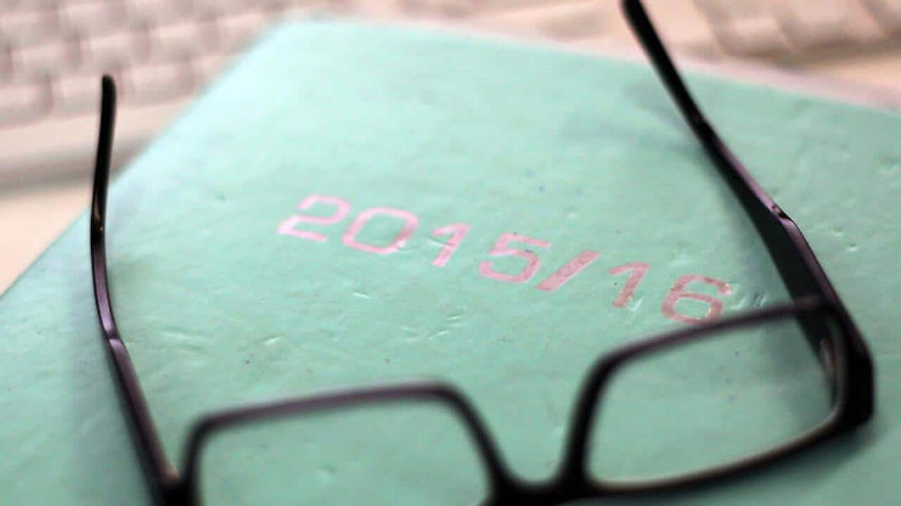 A 2015-2016 financial year diary is featured with reading glasses in a stock image in Sydney, Wednesday, Jan. 13, 2016. (AAP Image/Sam Mooy) NO ARCHIVING