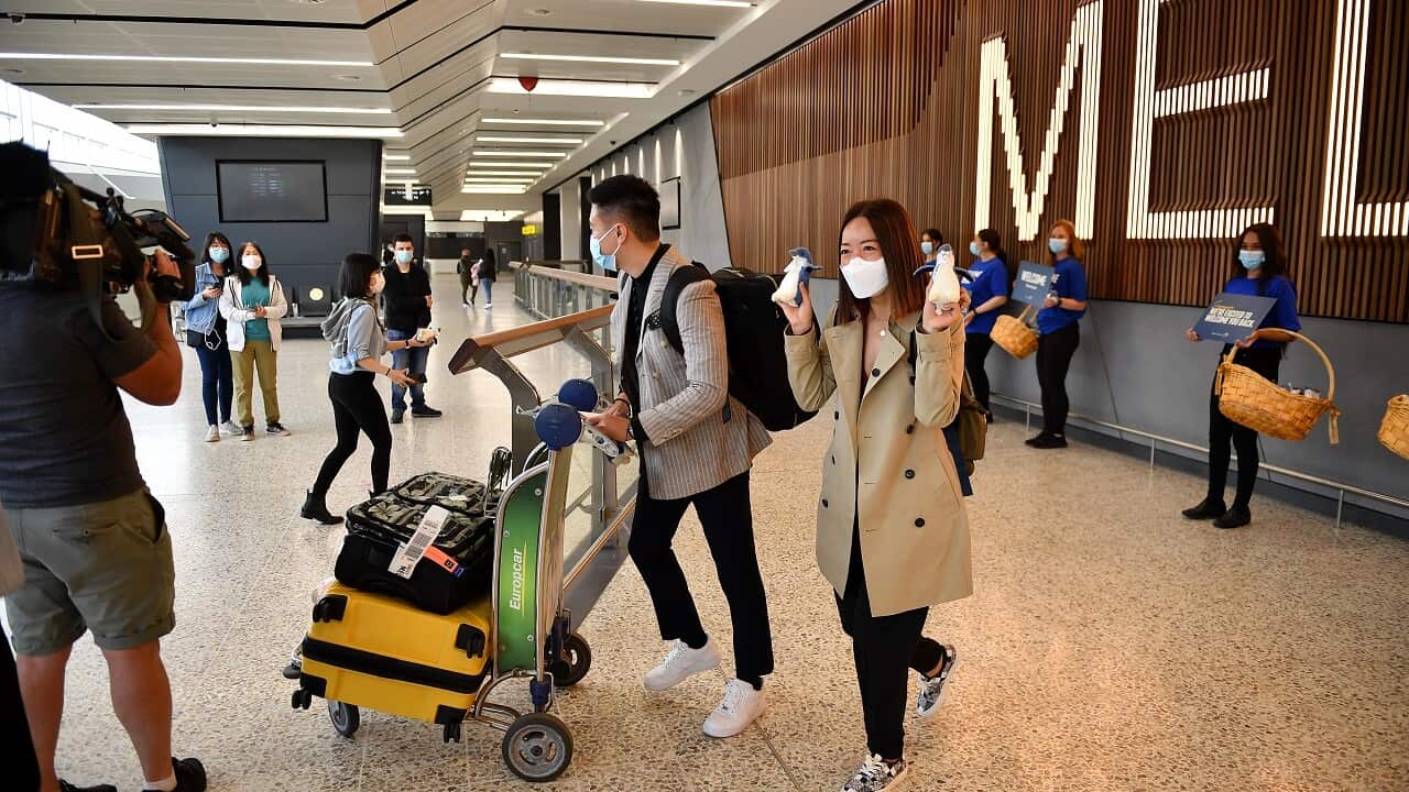 Passengers on a Singapore Airlines flight arrive at Melbourne International Airport in Melbourne, Sunday, November 21, 2021.