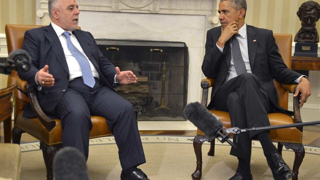US President Barack Obama with Iraqi Prime Minister Haider al-Abadi in the Oval Office of the White House in Washington DC, 14 April 2015. (EPA/MIKE THEILER / POOL)