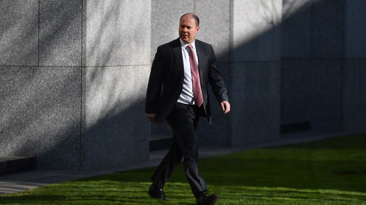 Treasurer Josh Frydenberg arrives at a press conference at Parliament House