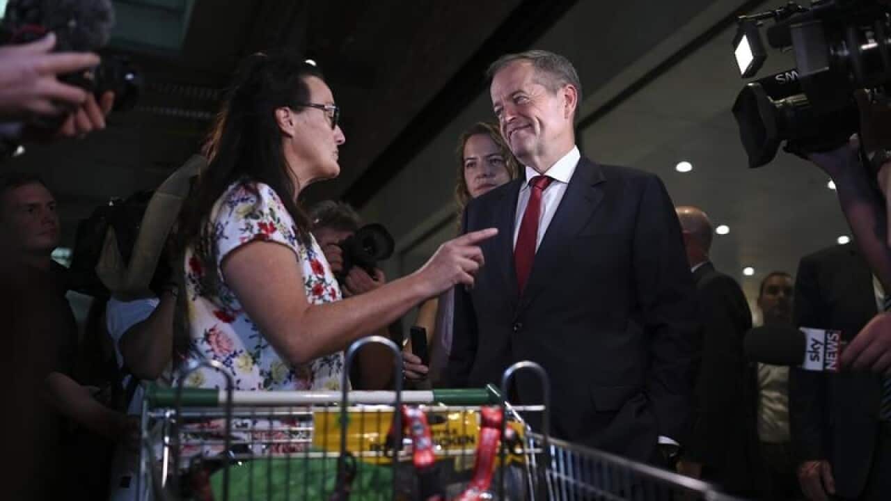Opposition Leader Bill Shorten speaks to a shopper IN aDELAIDE