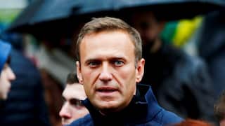 A man wearing a blue jacket