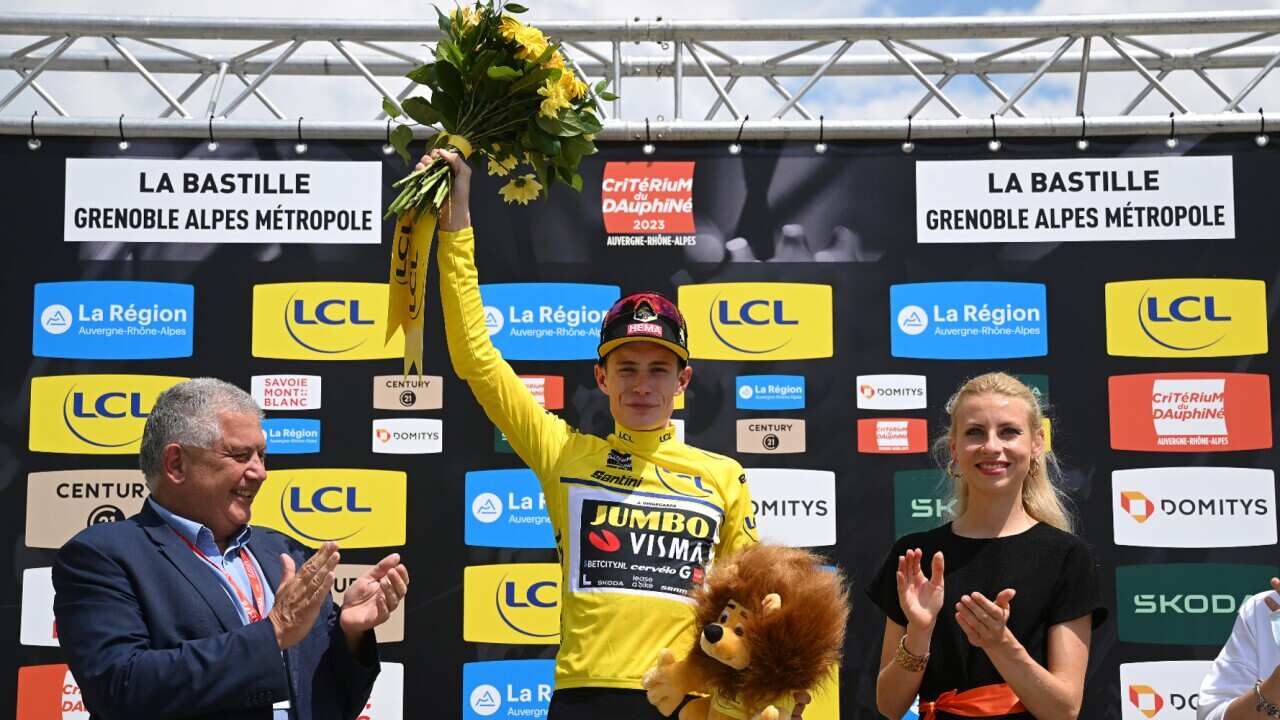 Jonas Vingegaard celebrates after winning the Criterium du Dauphine