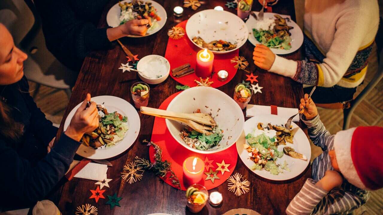 Family eating festive dinner