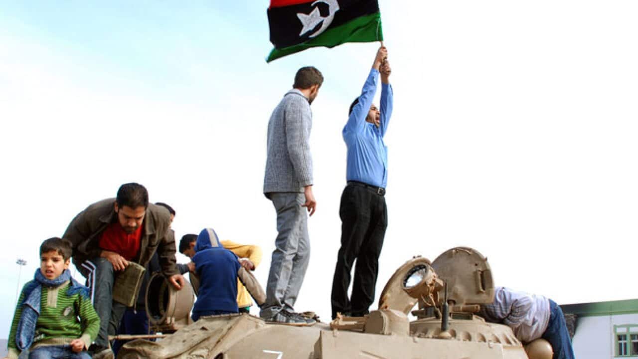 libya_protests_tank_flag_B_Getty_UPD_1972923178