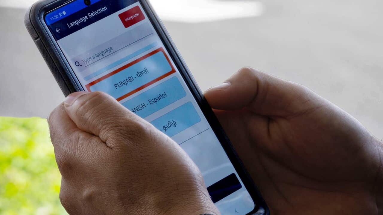 A police officer uses the Language Plus app (image supplied NSW Police).jpg