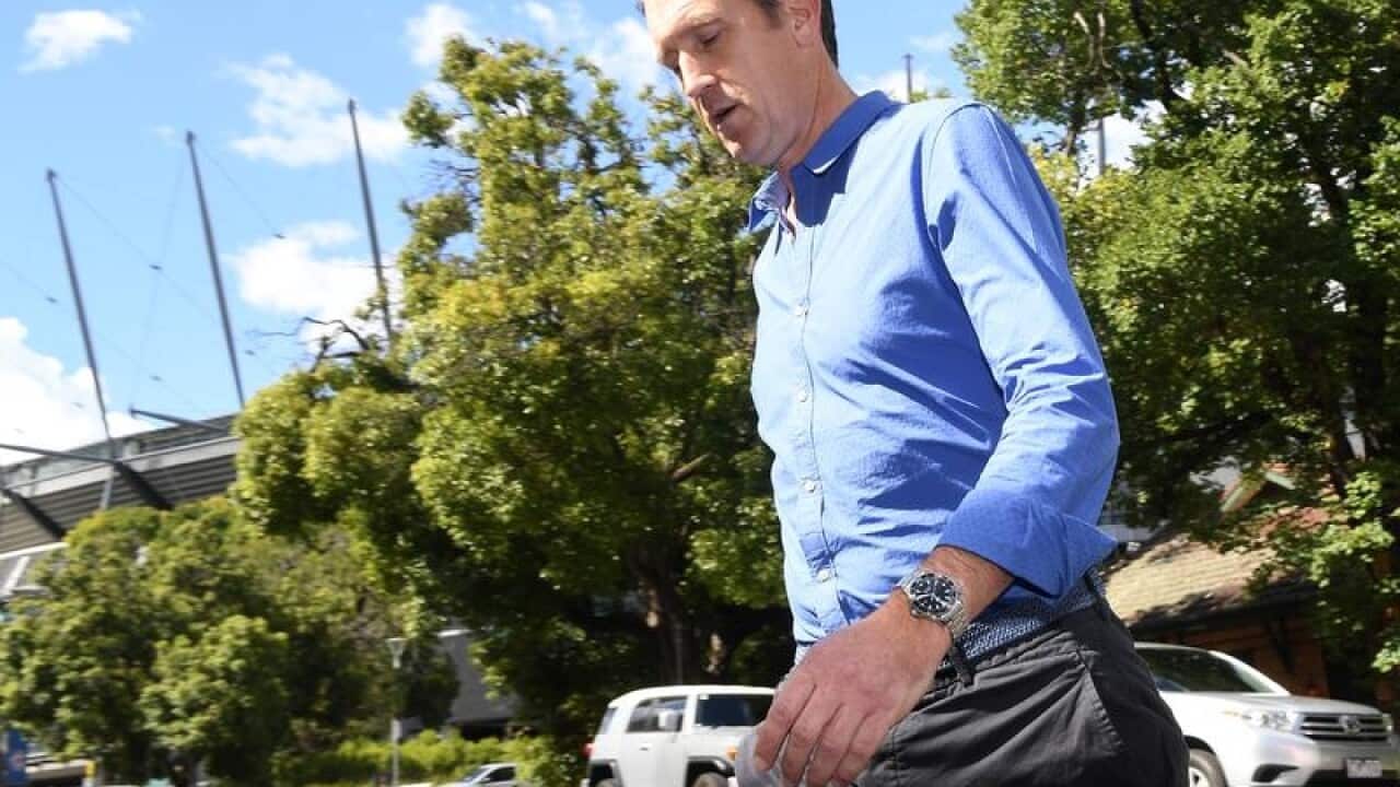 CA CEO James Sutherland leaves the cheating press conference.