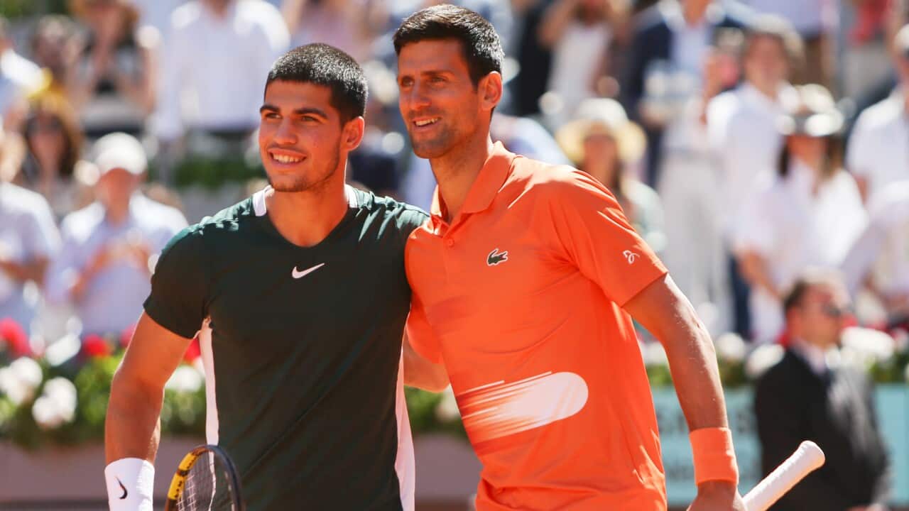 Carlos Alcaraz of Spain and Novak Djokovic of Serbia during the Mutua Madrid Open 2022.