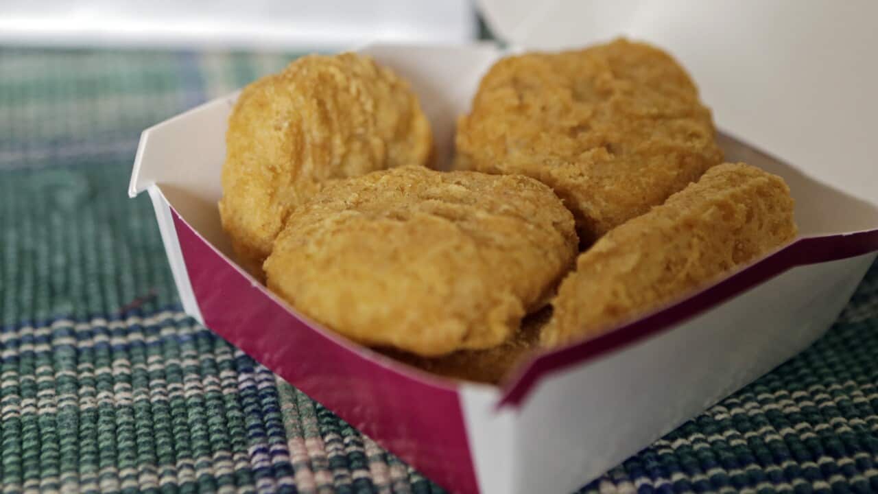 Several Chicken McNuggets in a box.