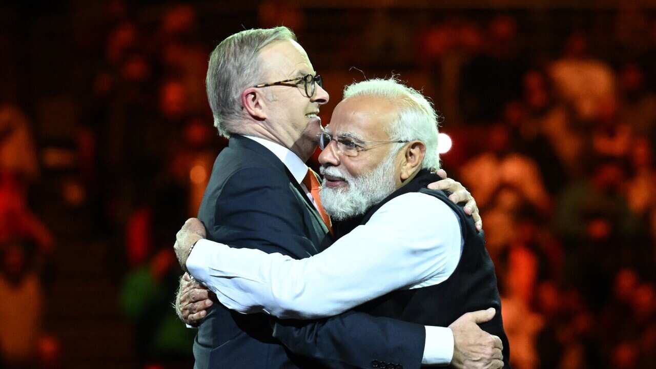 India’s Prime Minister Narendra Modi (right) and Australian Prime Minister Anthony Albanese embrace
