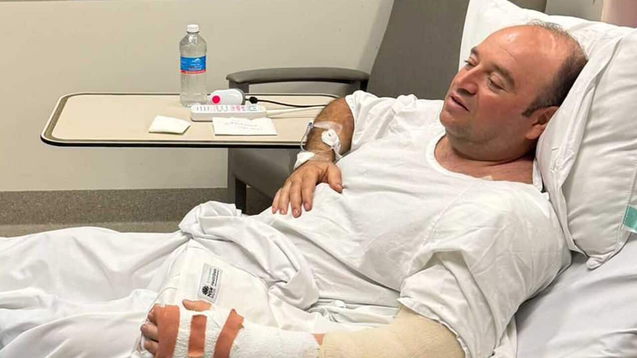 Ahmed Al-Ahmed in a hospital bed