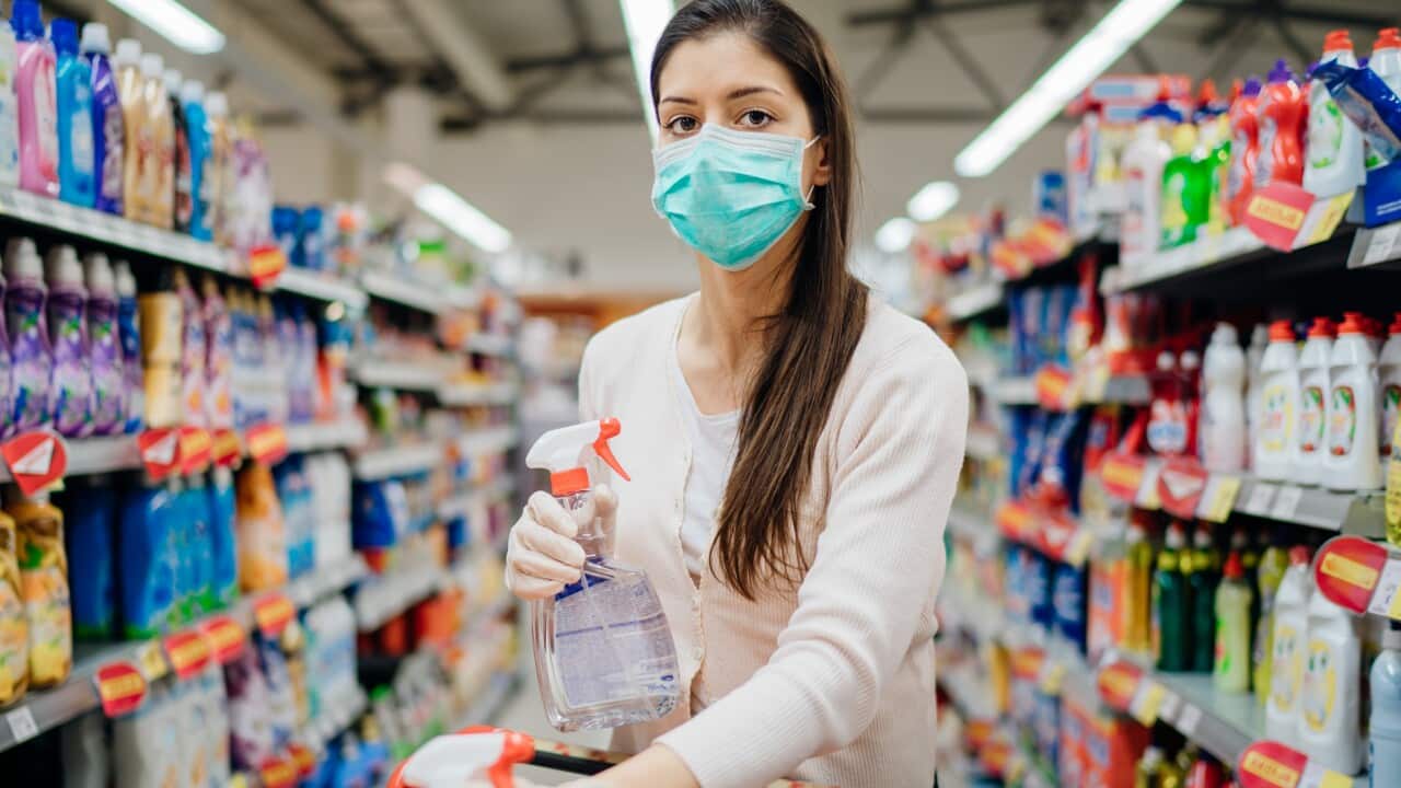 Woman wearing protective mask preparing for virus pandemic spread quarantine.
