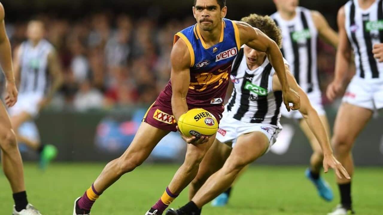 Charlie Cameron of the Lions in action against Collingwood.