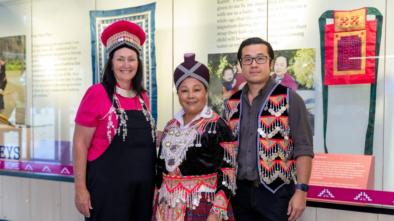 Cr Teresa Lane, Neng Vang and Dr Garry Yang in Hmong traditional clothing at the opening of the new exhibition.jpg