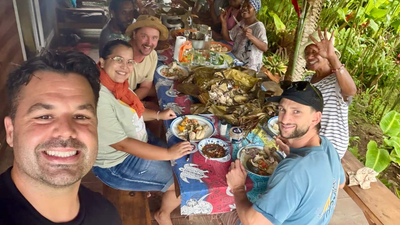 Warren Mendes enjoying a Kanak feast in New Caledonia.