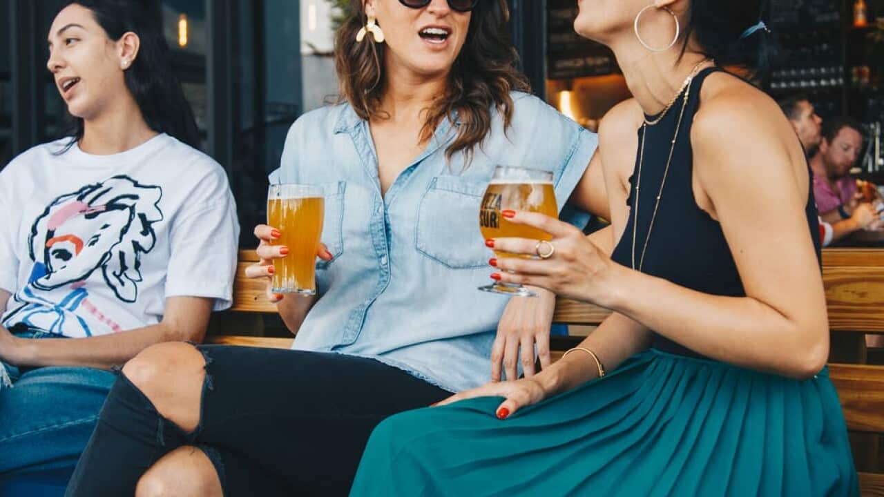 women drinking beer