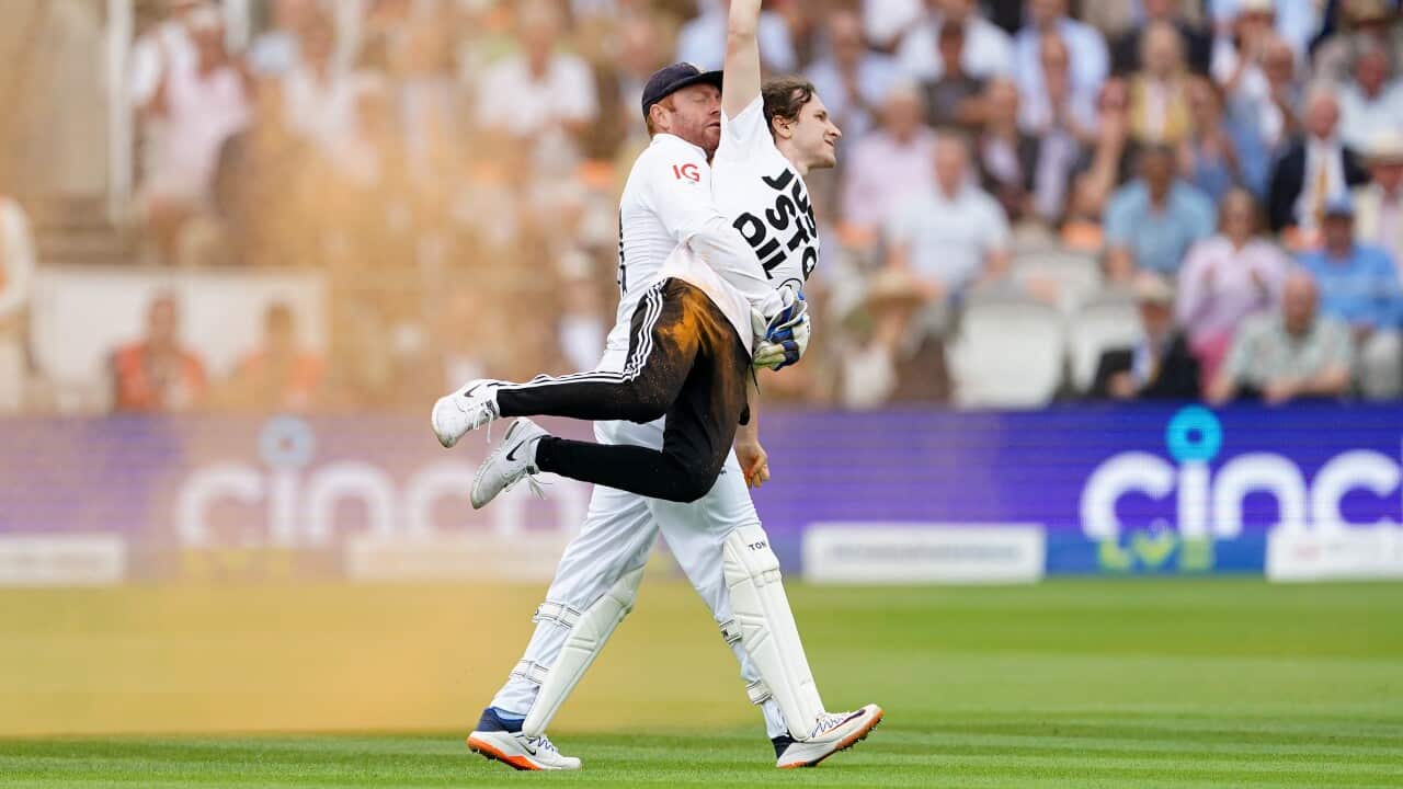 Jonny Bairstow removes a Just Stop Oil protester from cricket pitch