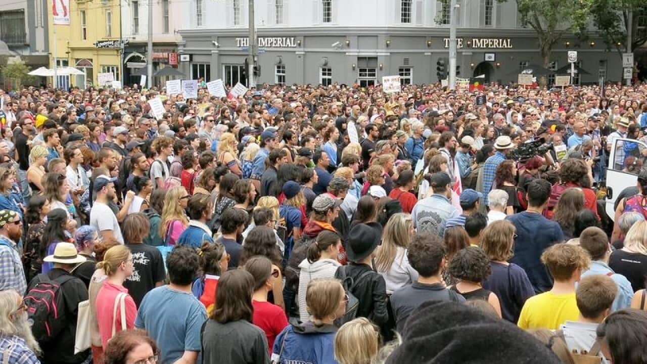 People attend an Invasion Day protest march in Melbourne