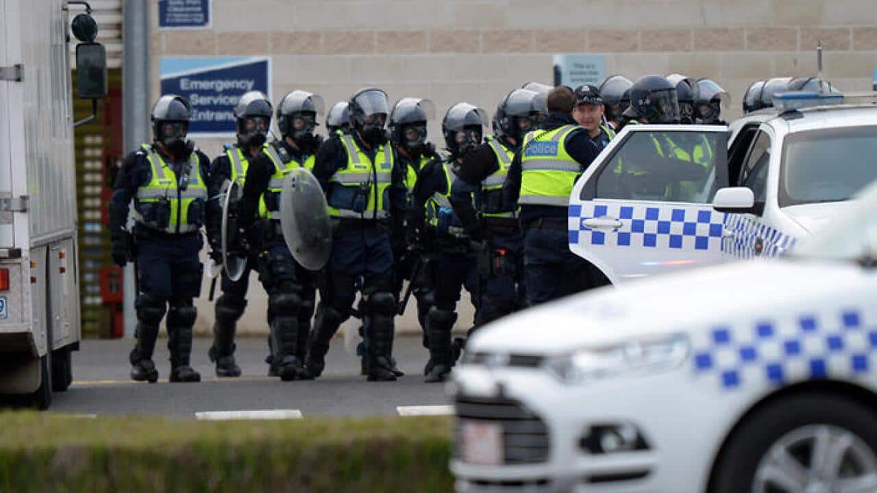 Police outside Ravenhall Prison, where inmates are rioting over a smoking ban that takes place tomorrow in Melbourne, Tuesday, June 30, 2015.