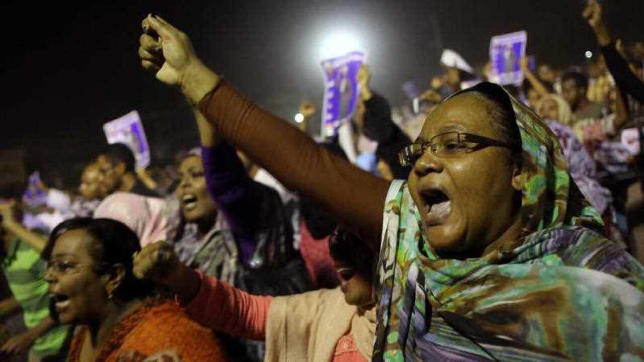 Sudanese anti-government protesters chant slogans during a demonstration in Khartoum, Sudan,